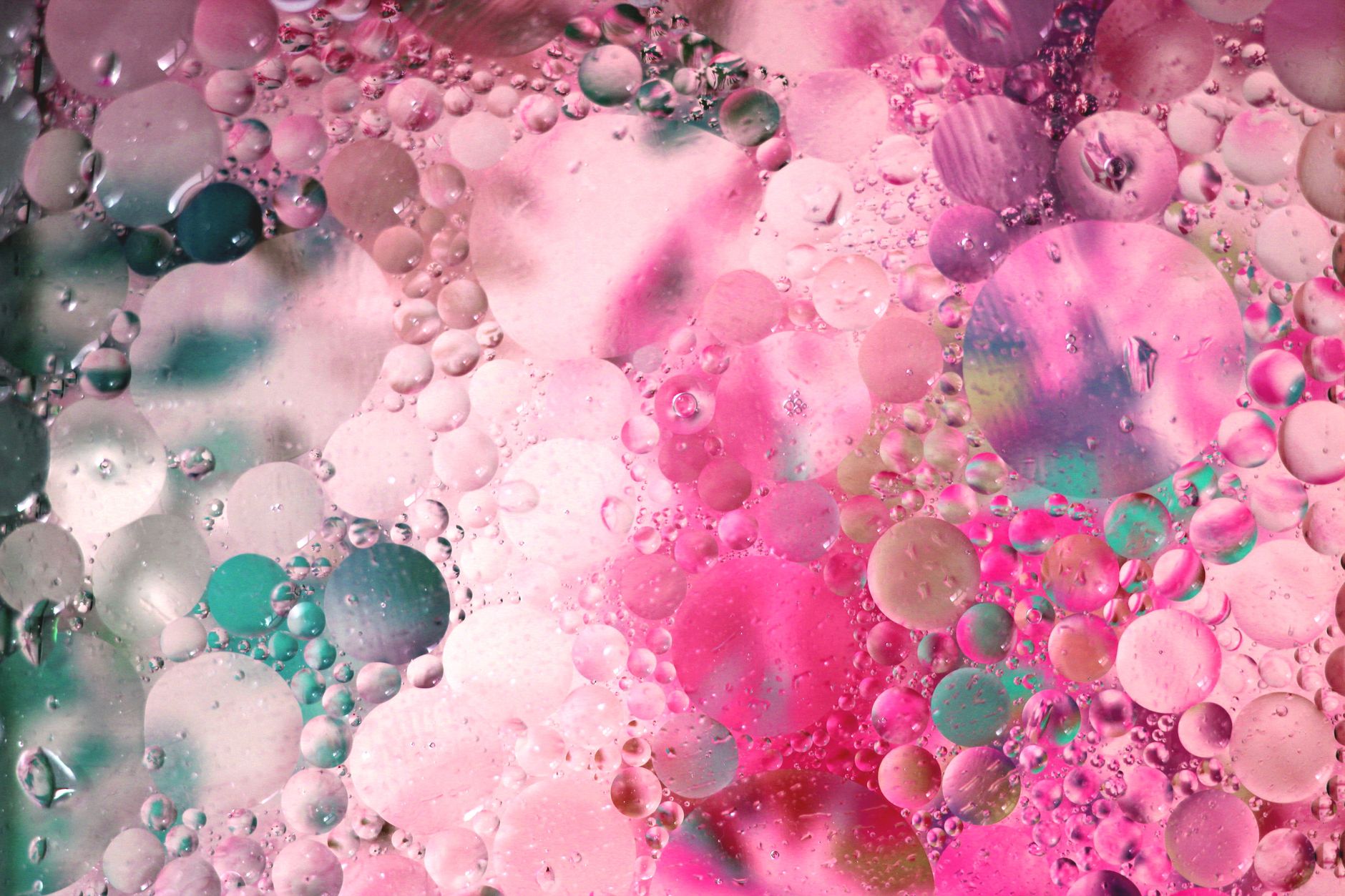 Colorful abstraction with droplets on pink and turquoise background, perfect for artistic and abstract themes.
